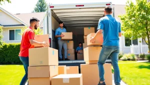 Movers Vancouver efficiently loading boxes into a moving truck during a sunny day.